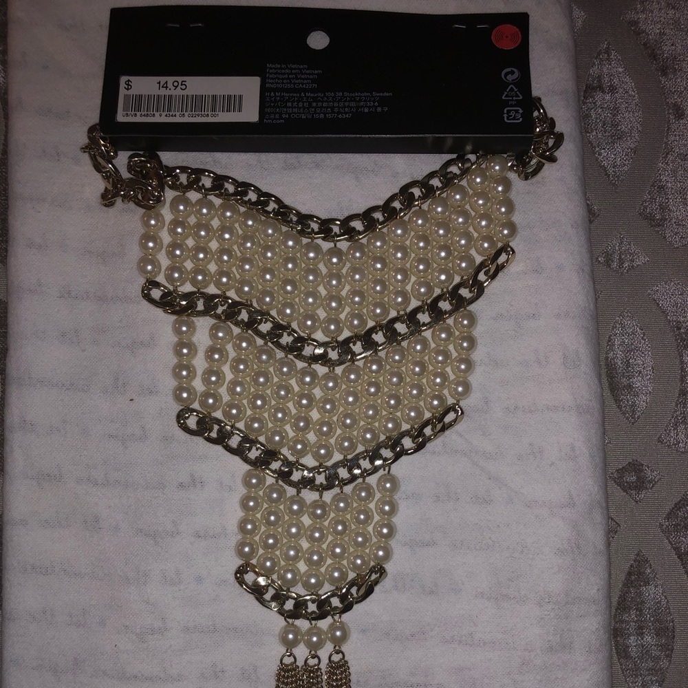 Pearl and gold color designed necklace